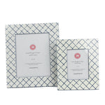 Two Bahama Court white and blue hand painted photo frames on a white background