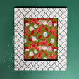 A blue and white photo frame featuring a trellis pattern from madcap cottage