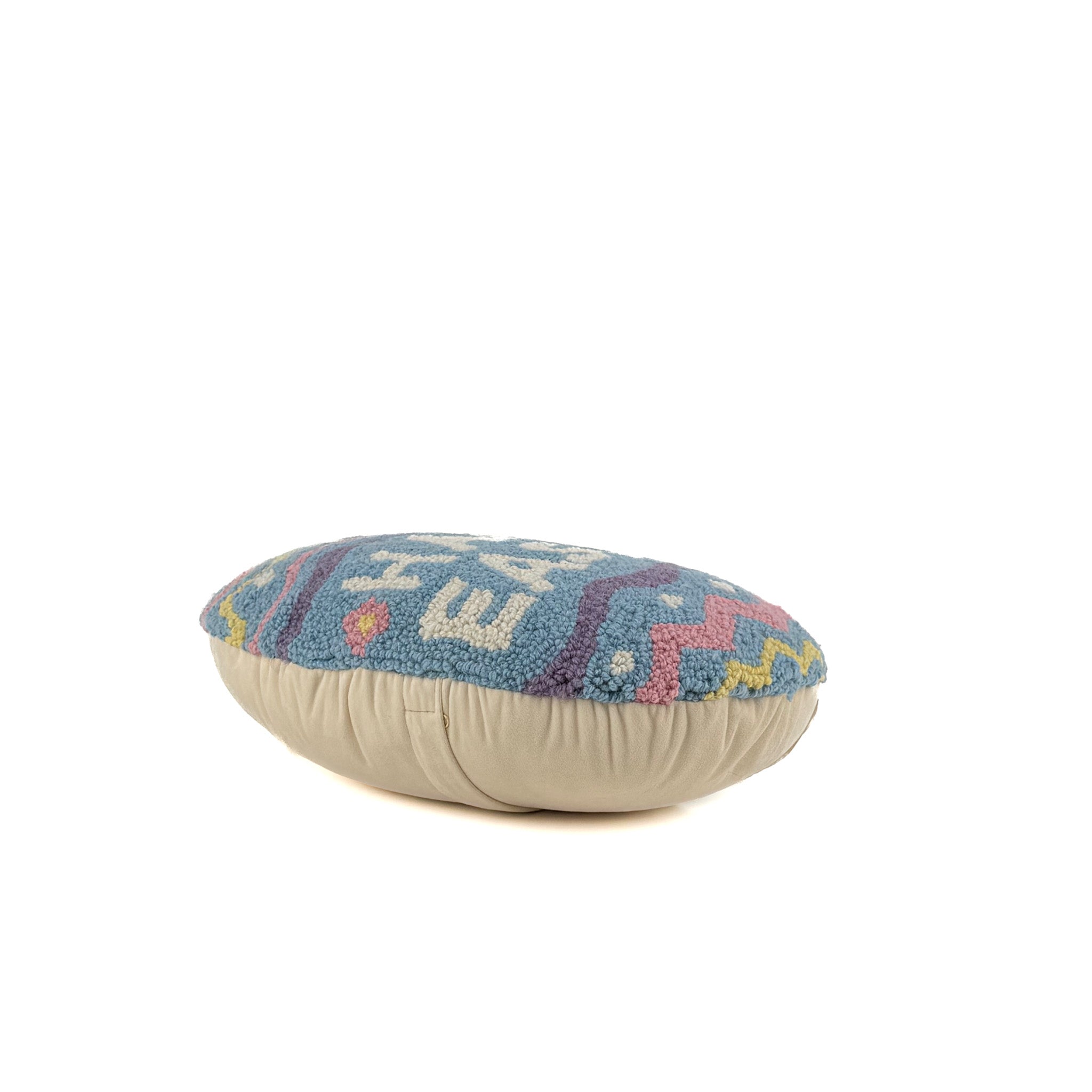 flat hooked pillow with Happy Easter text and colorful egg pattern design