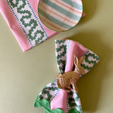 Harbor Trail Bahama pink cloth dinner napkins with a green ric rac trimfrom madcap cottage with a gold bunny napkin ring