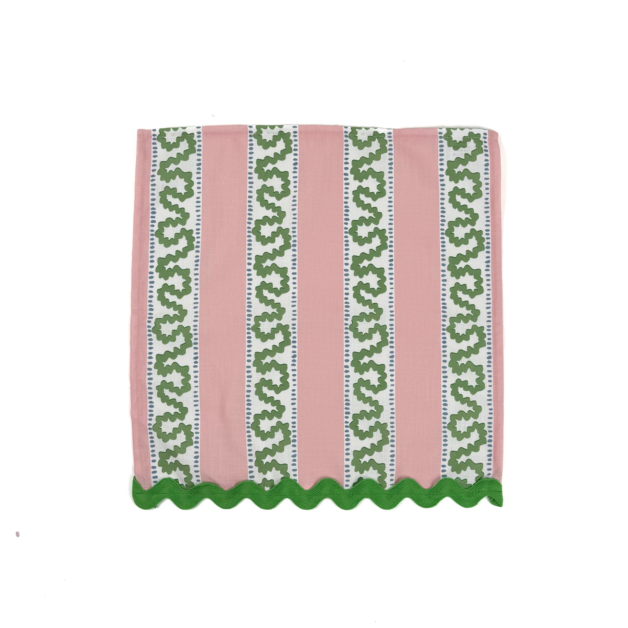 Pink tea towel with vertical green patterned stripes and scalloped green trim along the bottom edge.