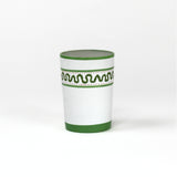 a green painted glass with a squiggly motif at the top called "Harbor Trail" by madcap cottage
