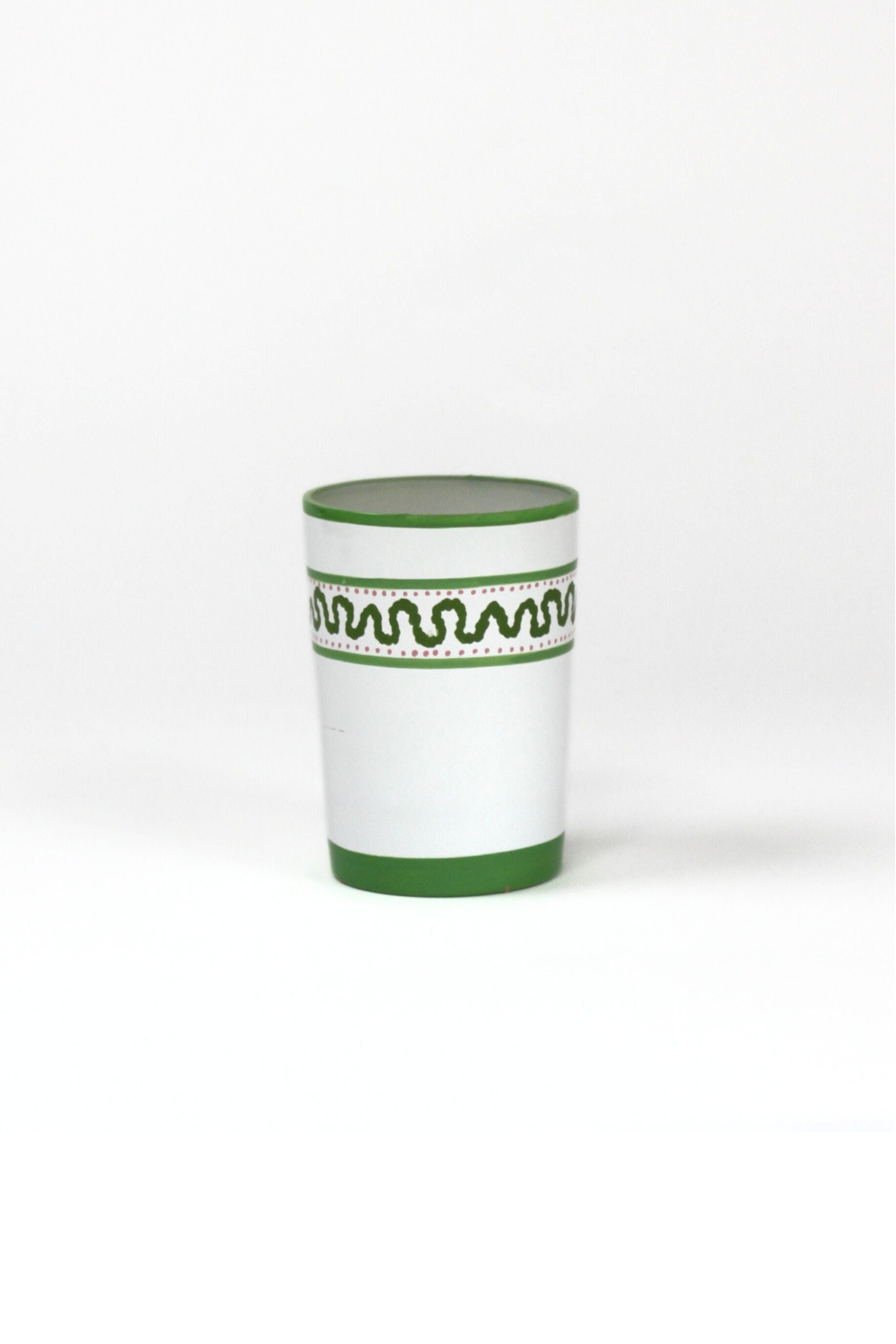 a green painted glass with a squiggly motif at the top called "Harbor Trail" by madcap cottage