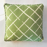 Green lattice accent pillow with cream crosshatch pattern and decorative cord trim