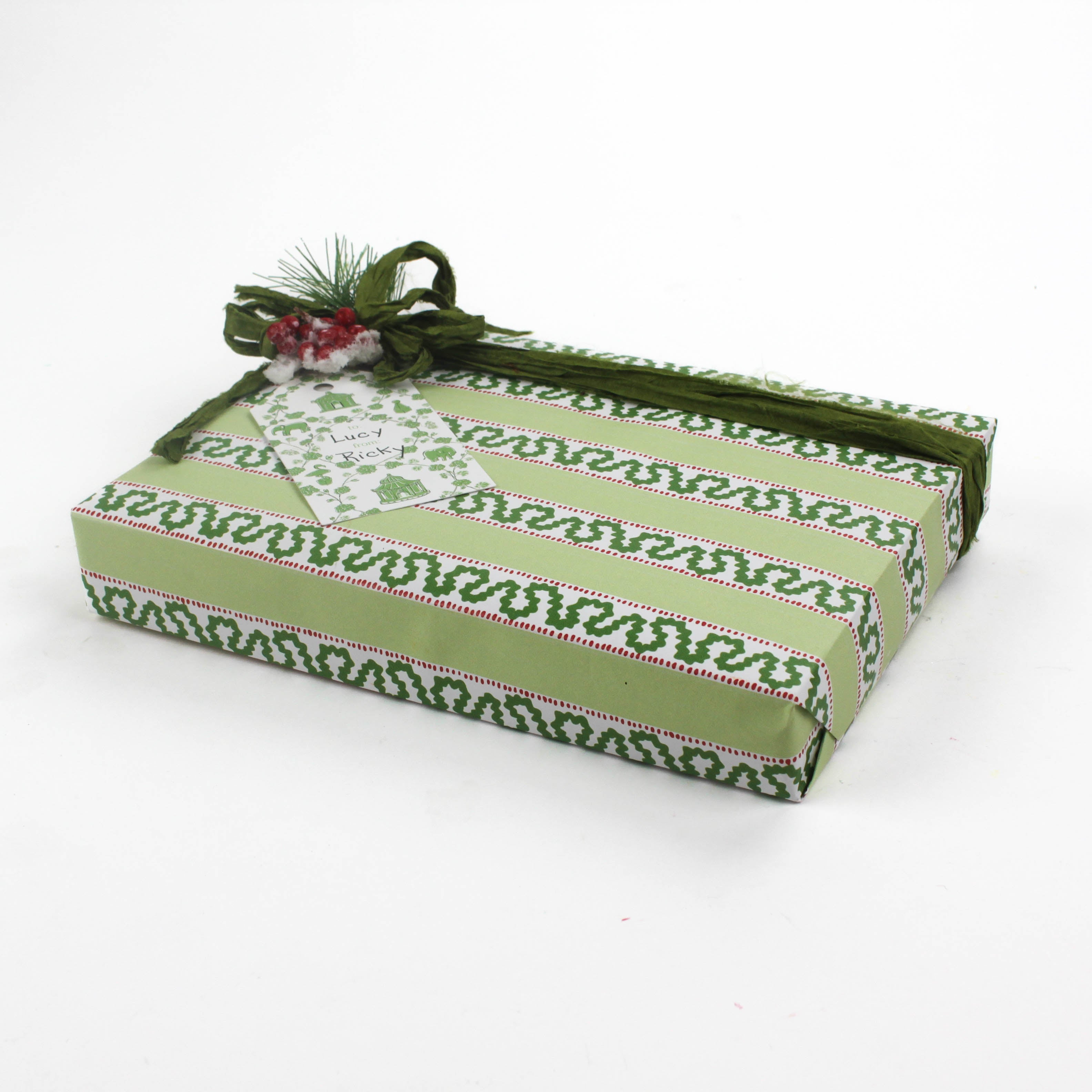 green wrapping paper in fancy stripe patterns