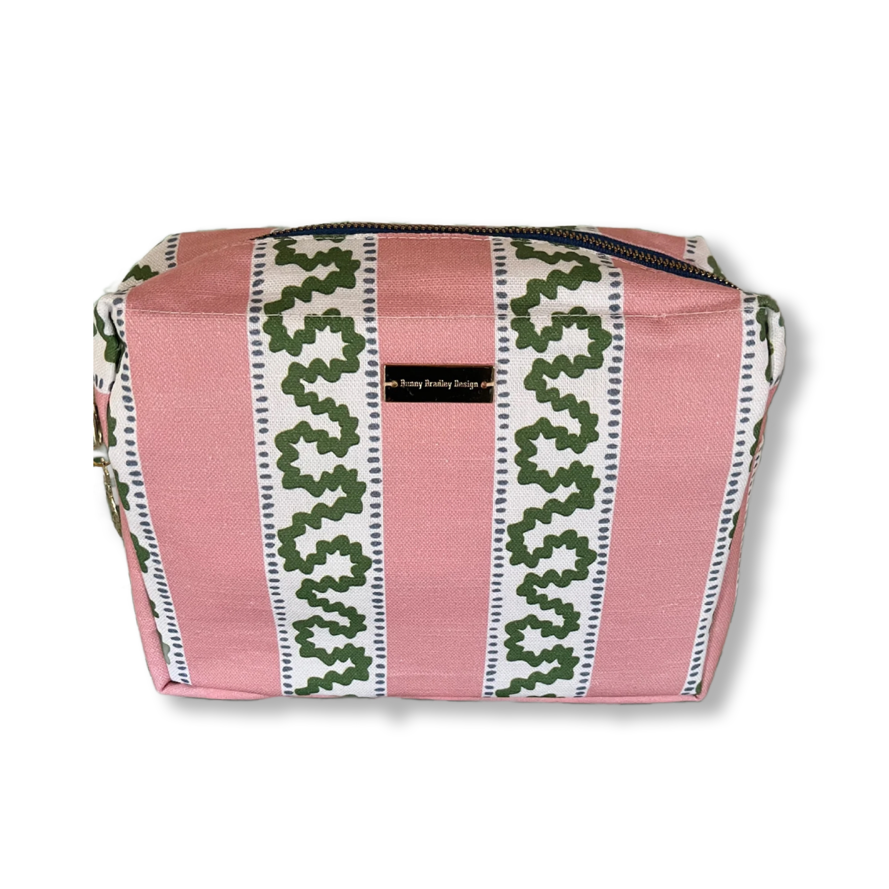 A Bahama pink Harbor Trail Large Cosmetics Bag with a toiletry and makeup items inside, set against a white background.