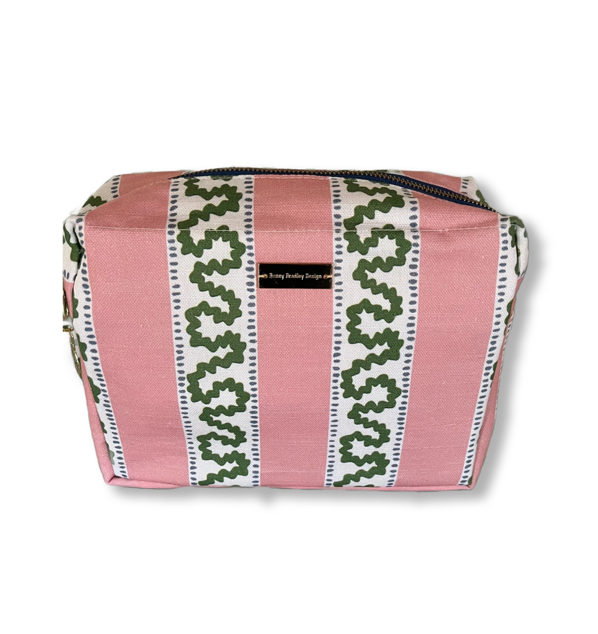 A Bahama pink Harbor Trail Large Cosmetics Bag with a toiletry and makeup items inside, set against a white background.
