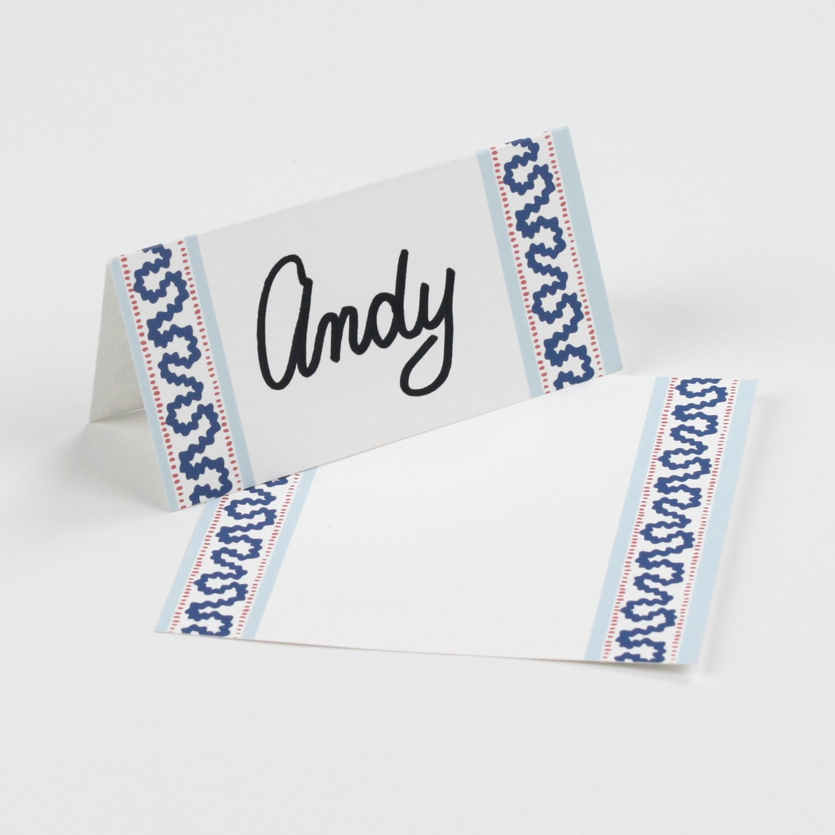 Harbor Trail Paper Place Cards in blue displayed on white background