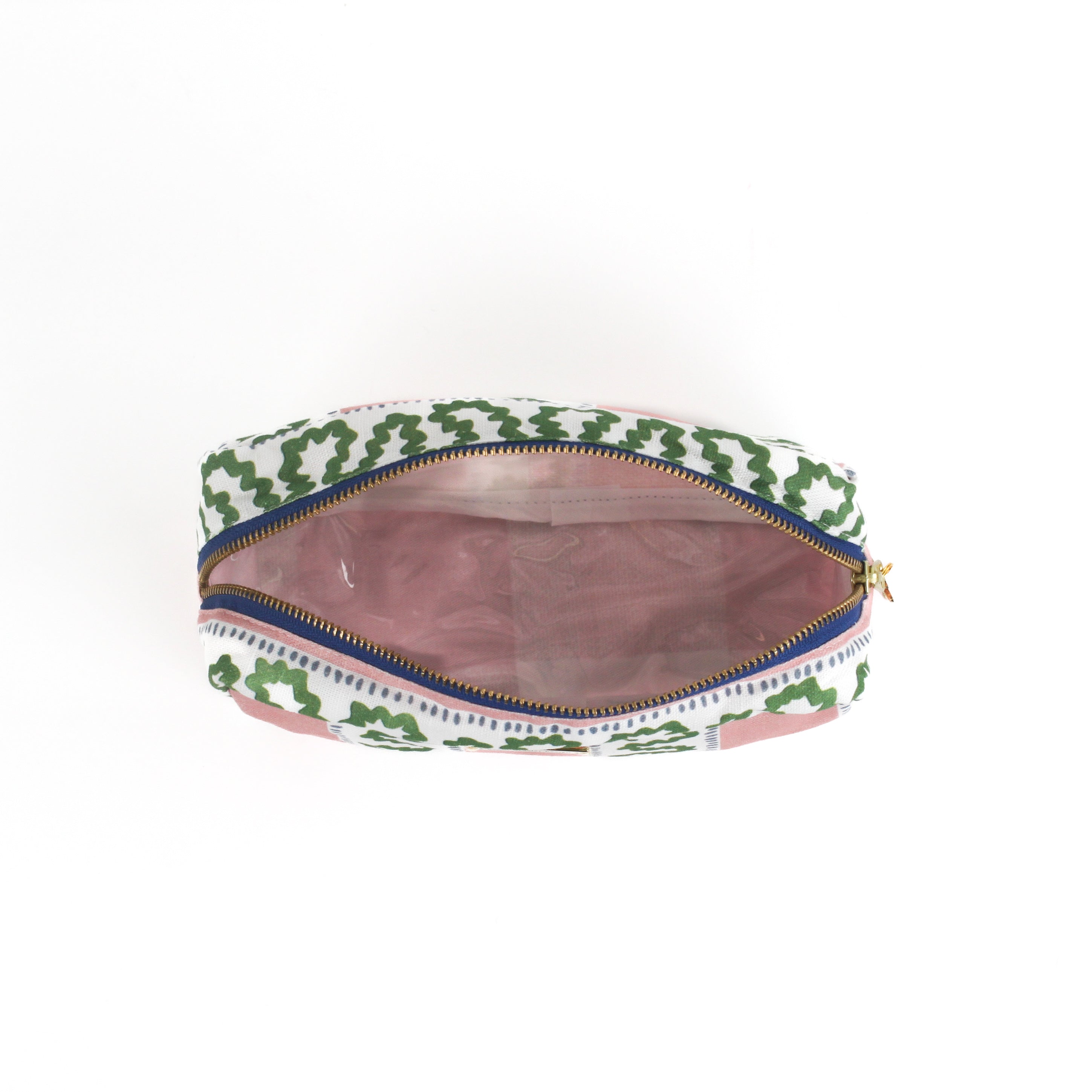 Interior view of amedium Harbor Trail toiletry bag in Bahama pink with a green ribbon and blue dash motif.