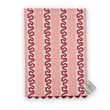 Harbor Trail cotton tea towel pink stripes, red wavy patterns, and green accents on a white background.