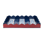 Decorative tray with scalloped edge in blue, white and red on a white background