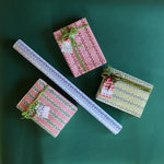 Four wrapping paper in fancy stripe patterns of assorted colors.