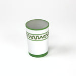 a green painted glass with a squiggly motif at the top called "Harbor Trail" by madcap cottage