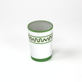 a green painted glass with a squiggly motif at the top called "Harbor Trail" by madcap cottage