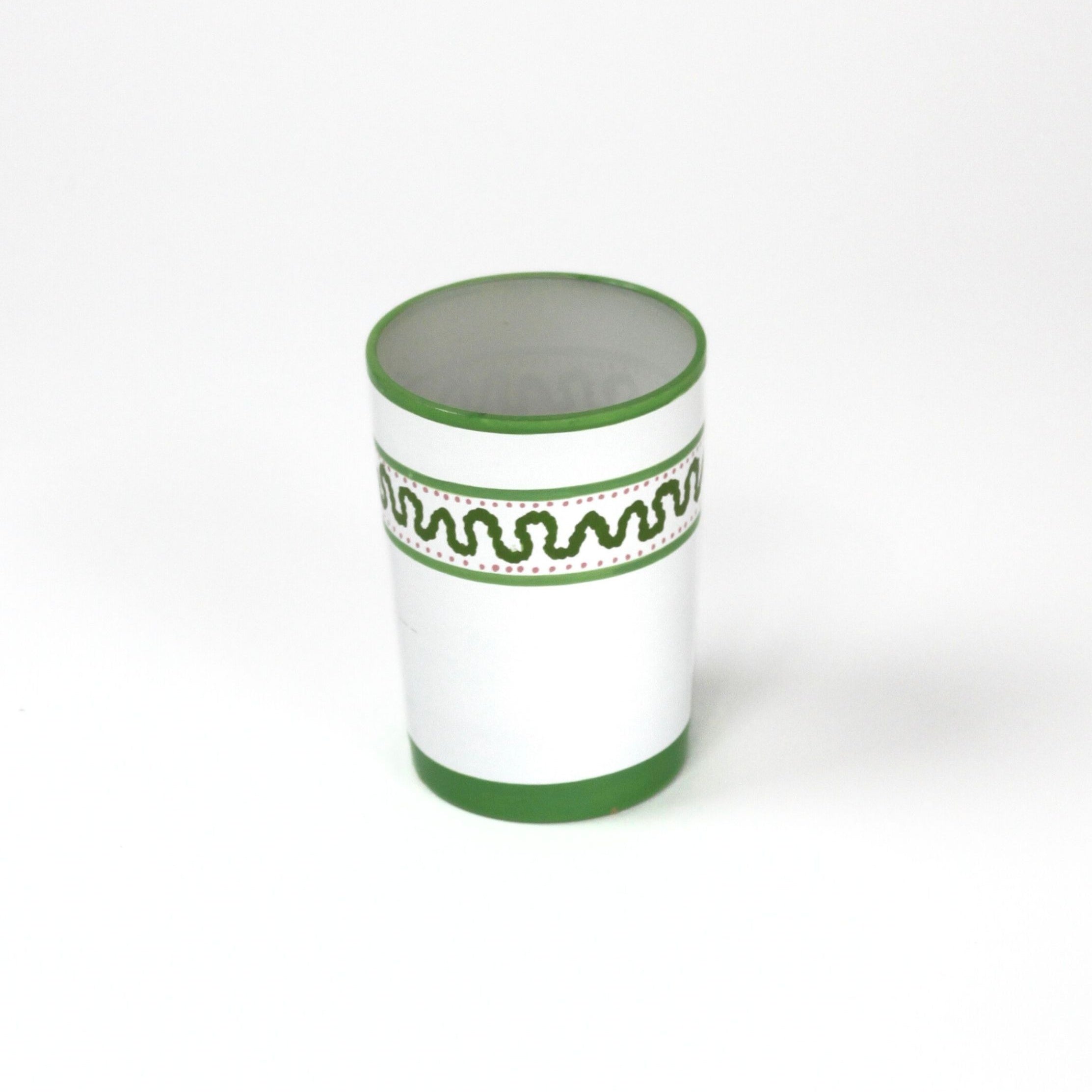 a green painted glass with a squiggly motif at the top called "Harbor Trail" by madcap cottage