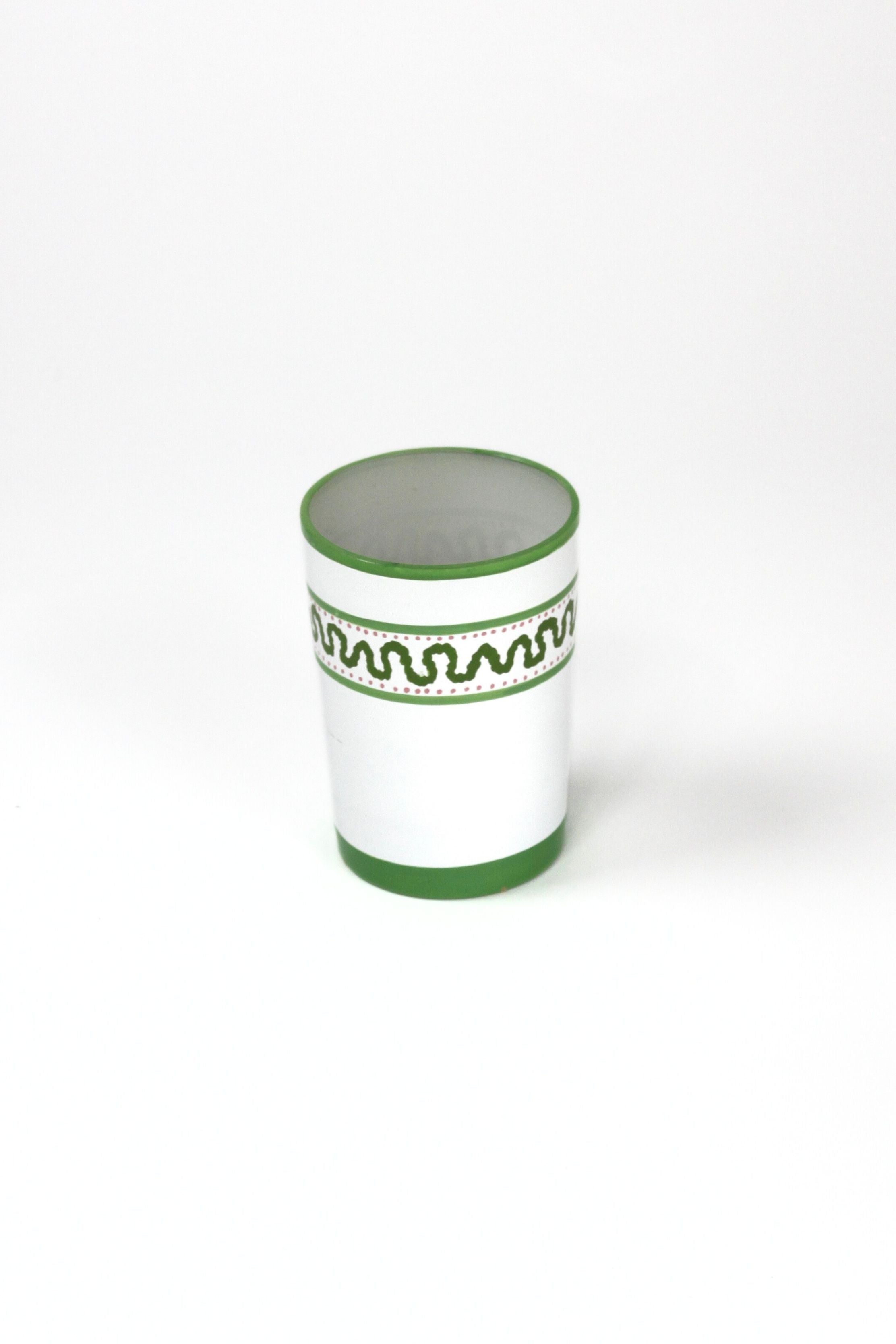 a green painted glass with a squiggly motif at the top called "Harbor Trail" by madcap cottage