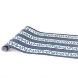 A navy blue and white striped paper table runner with a central light blue wavy stripe on a white background. 