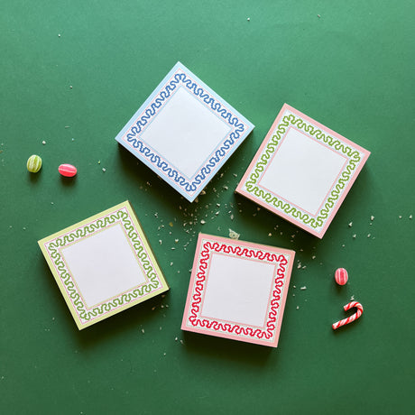 Square notepads with a decorative border and a placeholder graphic icon on a green background.