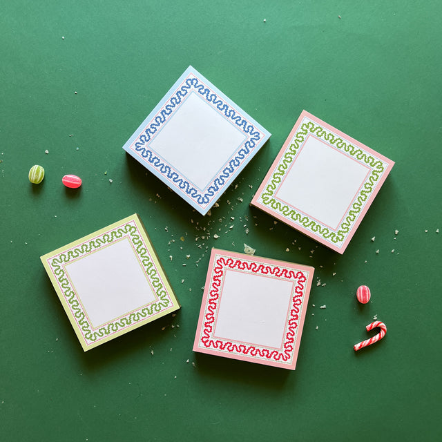 Square notepads with a decorative border and a placeholder graphic icon on a green background.
