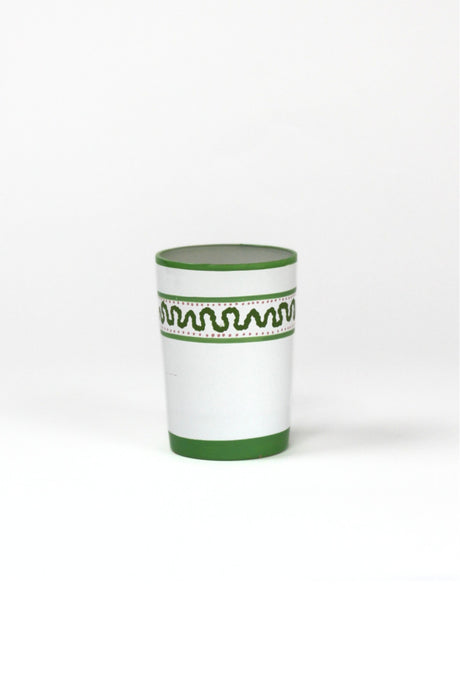 a green painted glass with a squiggly motif at the top called "Harbor Trail" by madcap cottage