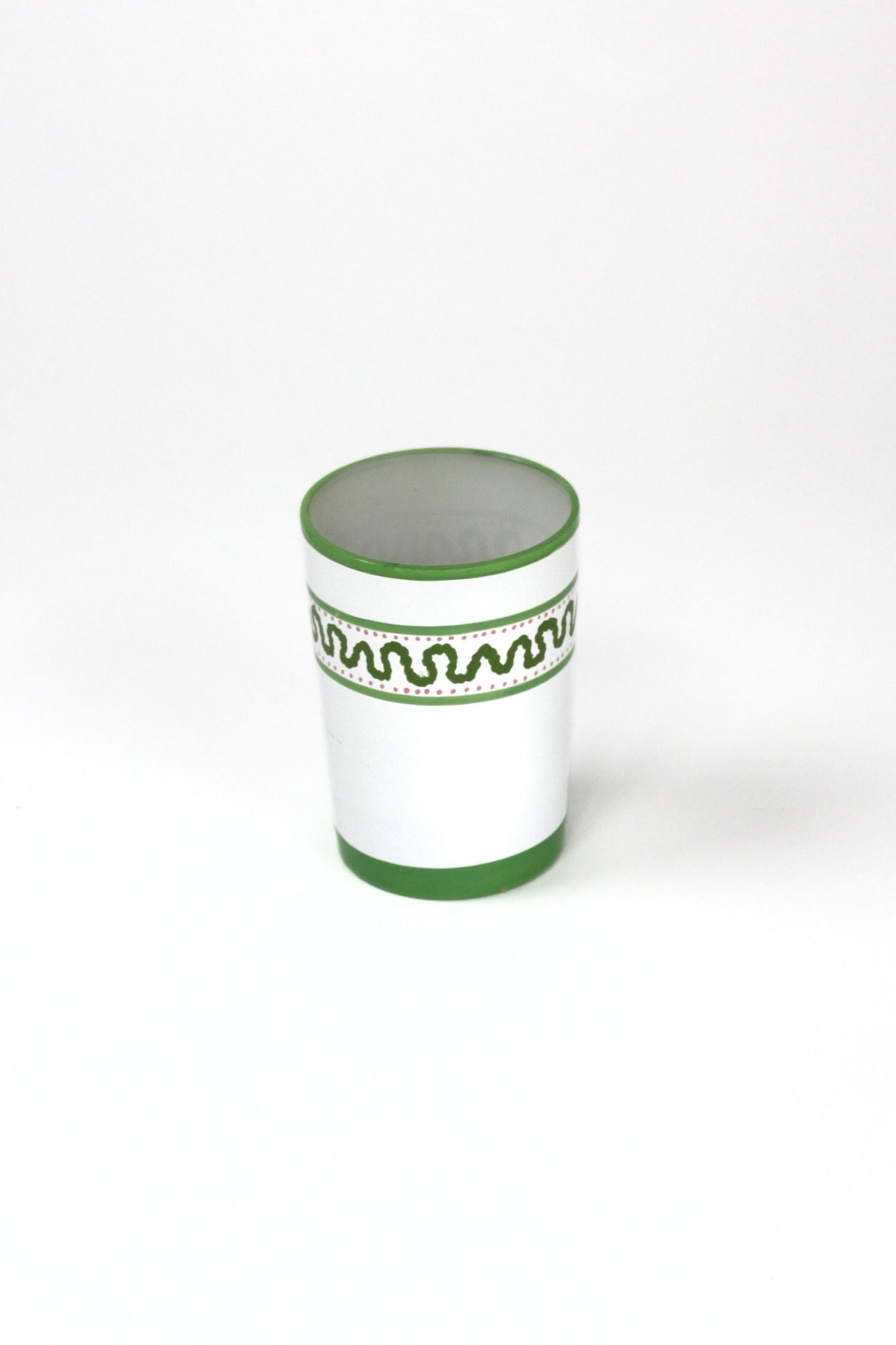 a green painted glass with a squiggly motif at the top called "Harbor Trail" by madcap cottage