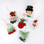 Handcrafted Holiday Icons Felt Christmas Ornaments featuring Santa, elf, snowman, mitten, Christmas tree, and reindeer designs in festive red, green, and white colors.