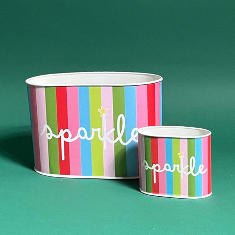 Empty duo of Holiday Sparkle Christmas caddies in large and small on a green background