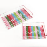 A rectangular acrylic tray with colorful striped pattern and the word 'sparkle' displayed prominently in the center.