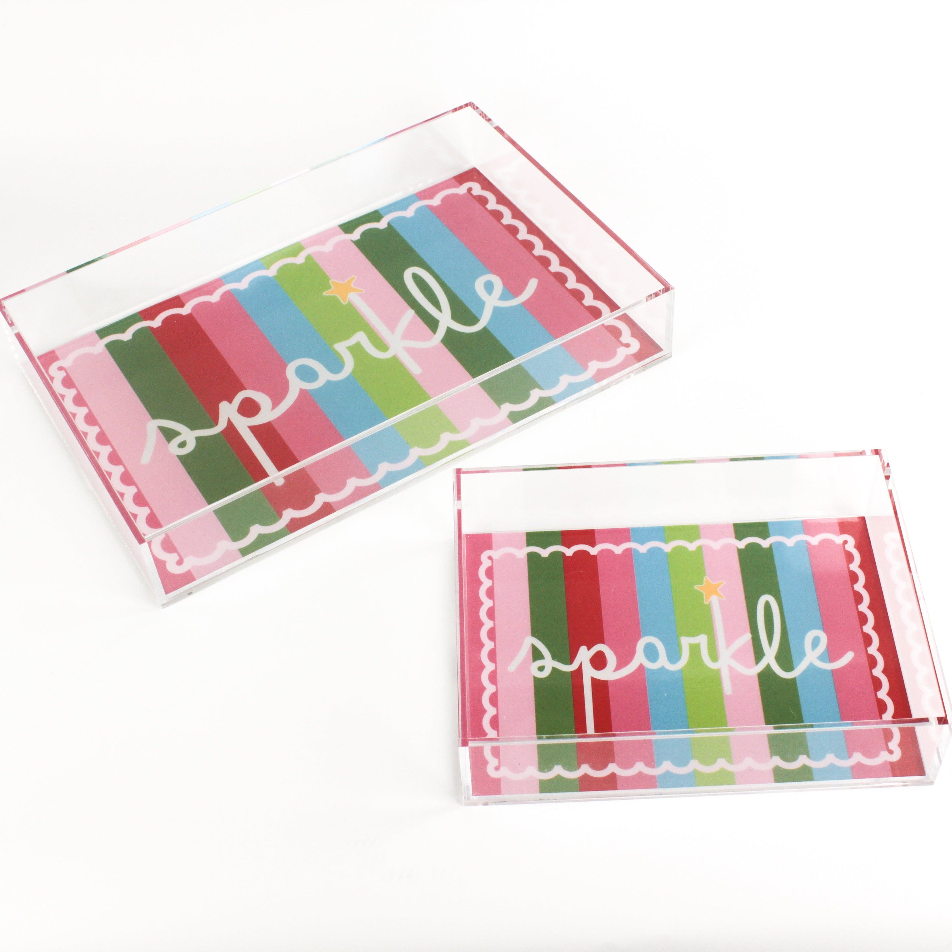 A rectangular acrylic tray with colorful striped pattern and the word 'sparkle' displayed prominently in the center.