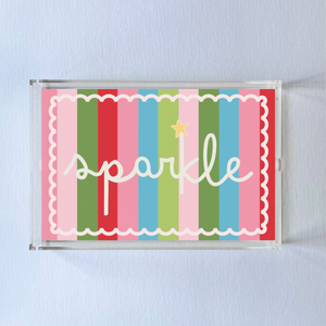 A rectangular acrylic tray with colorful striped pattern and the word 'sparkle' displayed prominently in the center.