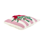 White and pink striped christmas pillow with holly design and red bow on its side on a white background.