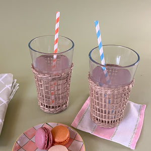 drinking glasses with seagrass sleeve with cocktail napkin and cookies on a plaid plate