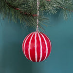 red white christmas ornaments on a blue background