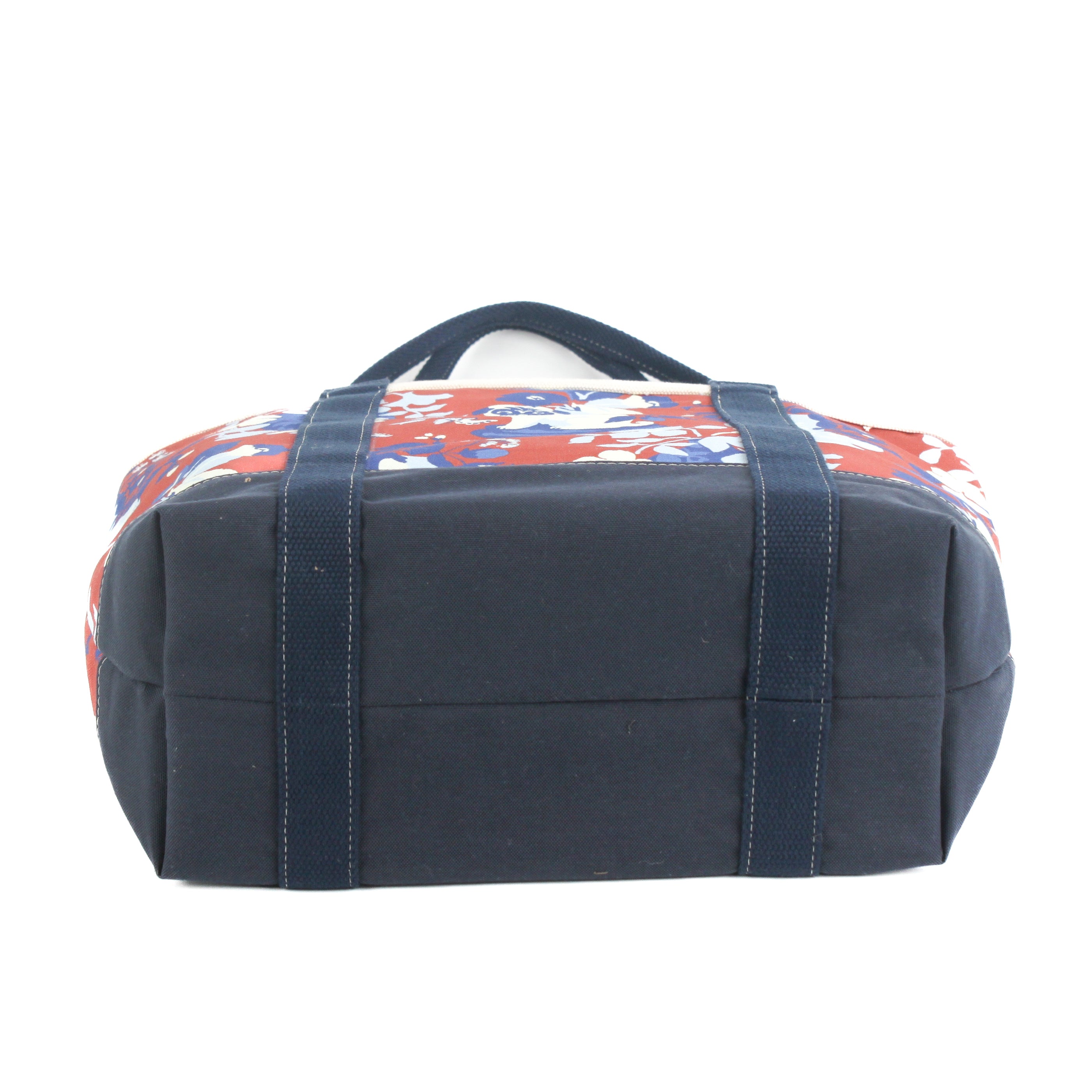 a large Imperial Palace canvas tote bag, in a red, white and blue chinoiserie pattern featuring white pug dogs showing the bottom part