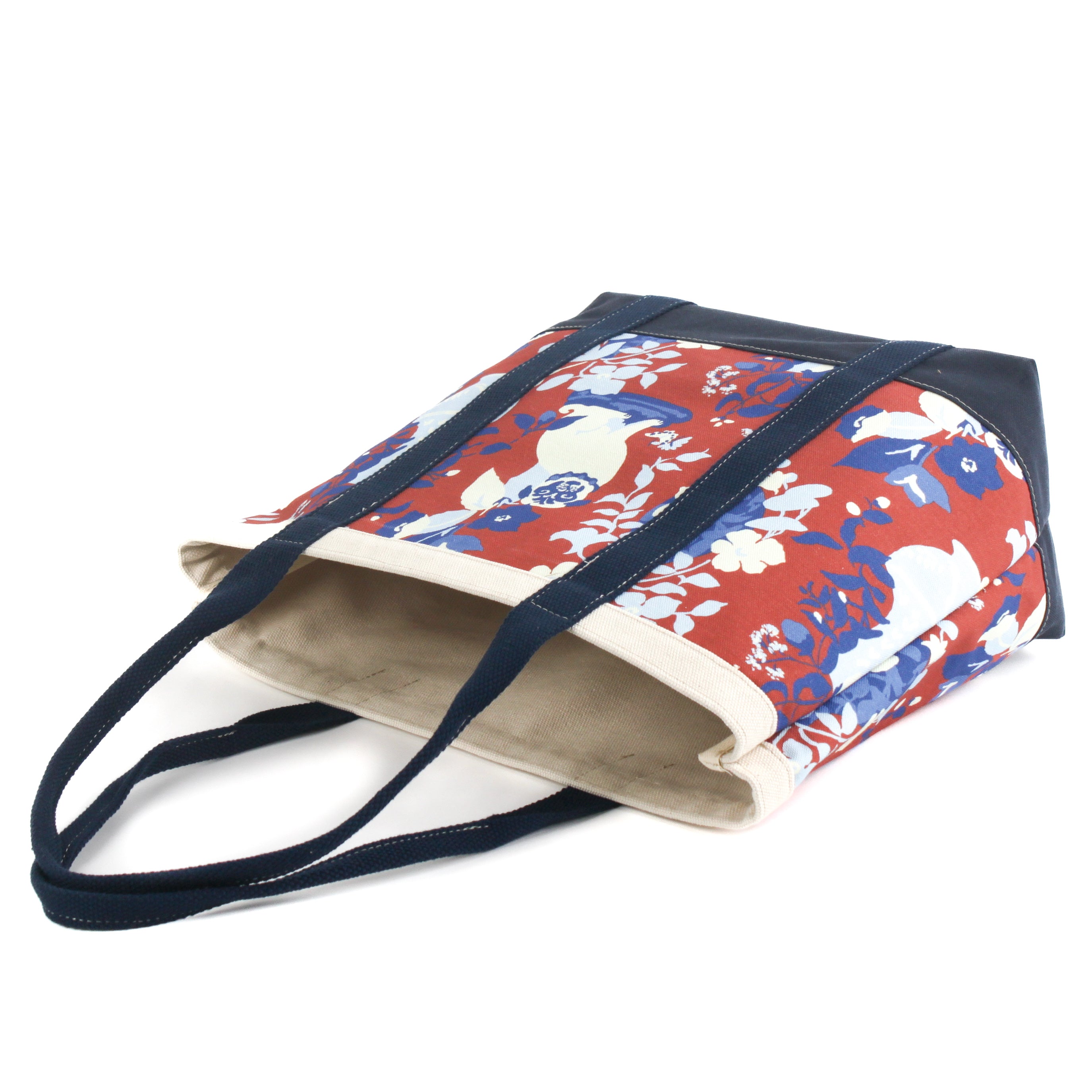 a large Imperial Palace canvas tote bag, in a red, white and blue chinoiserie pattern featuring white pug dogs