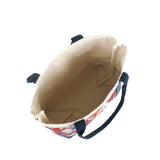 a large Imperial Palace canvas tote bag, in a red, white and blue chinoiserie pattern featuring white pug dogs showing the inside of the bag