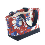 a small Imperial Palace canvas tote bag, in a red, white and blue chinoiserie pattern featuring white pug dogs
