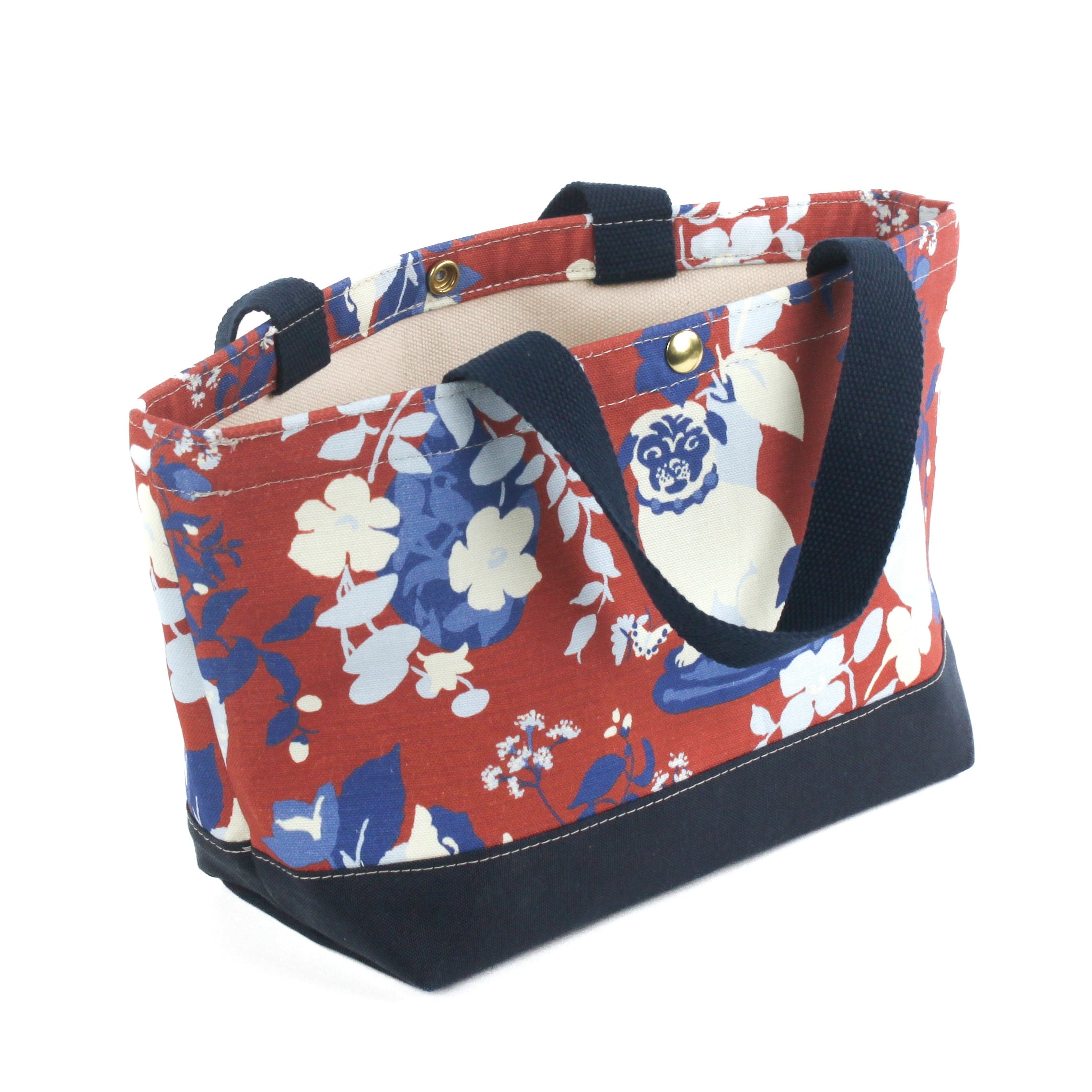 a small Imperial Palace canvas tote bag, in a red, white and blue chinoiserie pattern featuring white pug dogs