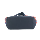 a small Imperial Palace canvas tote bag, in a red, white and blue chinoiserie pattern featuring white pug dogs showing the bottom