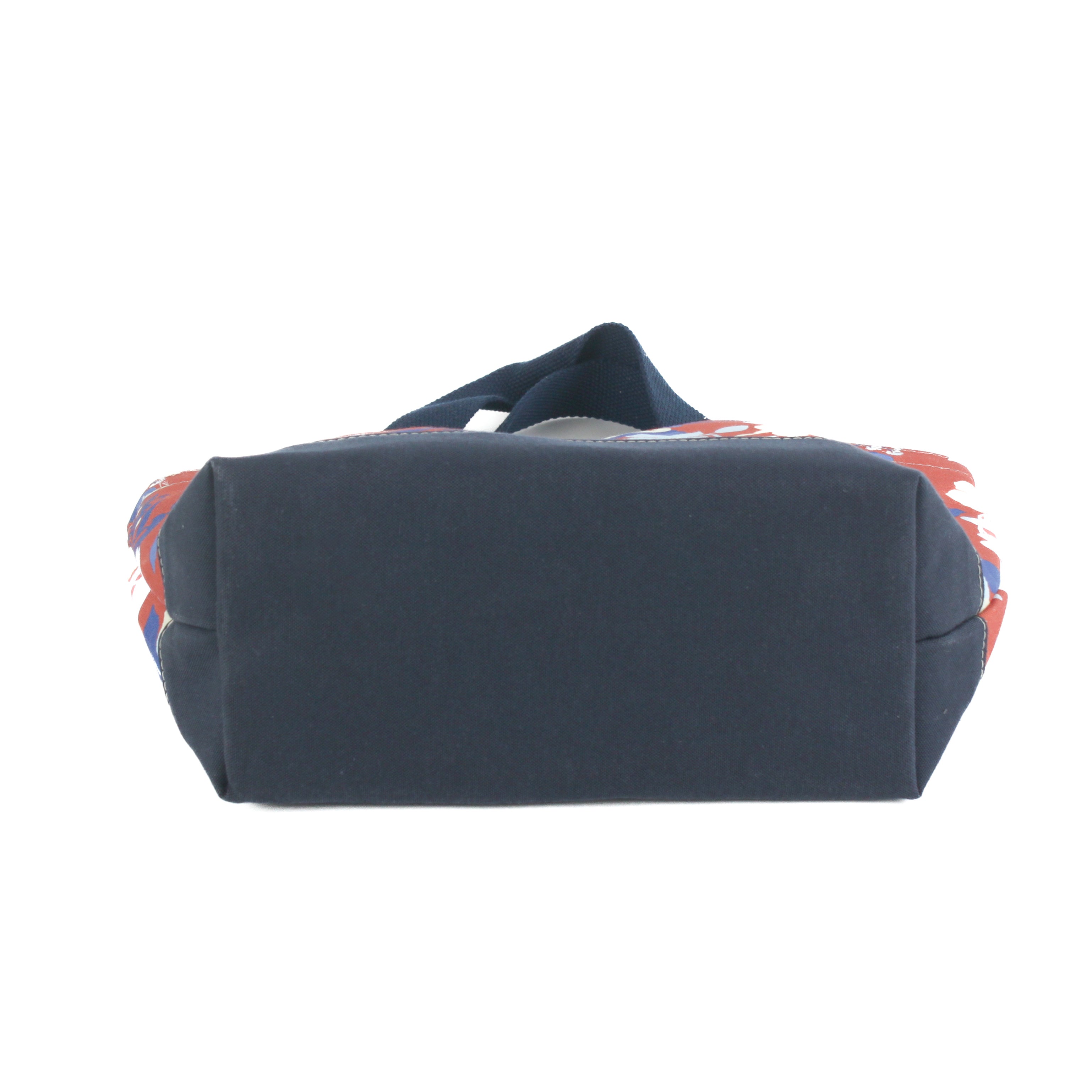 a small Imperial Palace canvas tote bag, in a red, white and blue chinoiserie pattern featuring white pug dogs showing the bottom