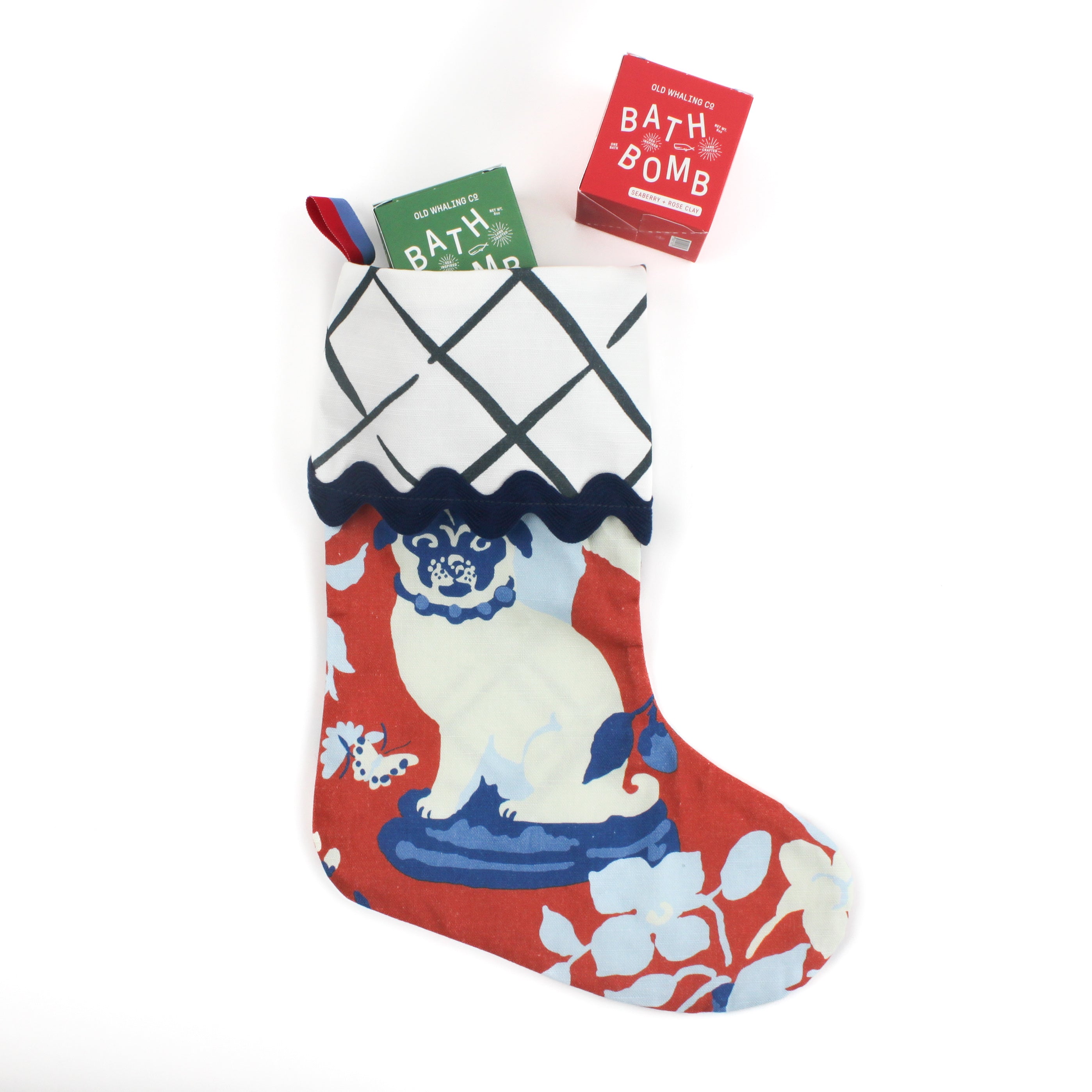 Red and Blue Chinoiserie Christmas stocking with a pug design on a white background
