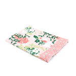 a pink and green chinoiserie pug tea towel with repeating dogs and flower filled vase motifs against a white background. 