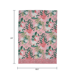 a pink and green chinoiserie pug tea towel with repeating dogs and flower filled vase motifs against a white background. 