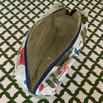 Interior view of Meadow Club toiletry bag in sky blue features a lily pond pattern