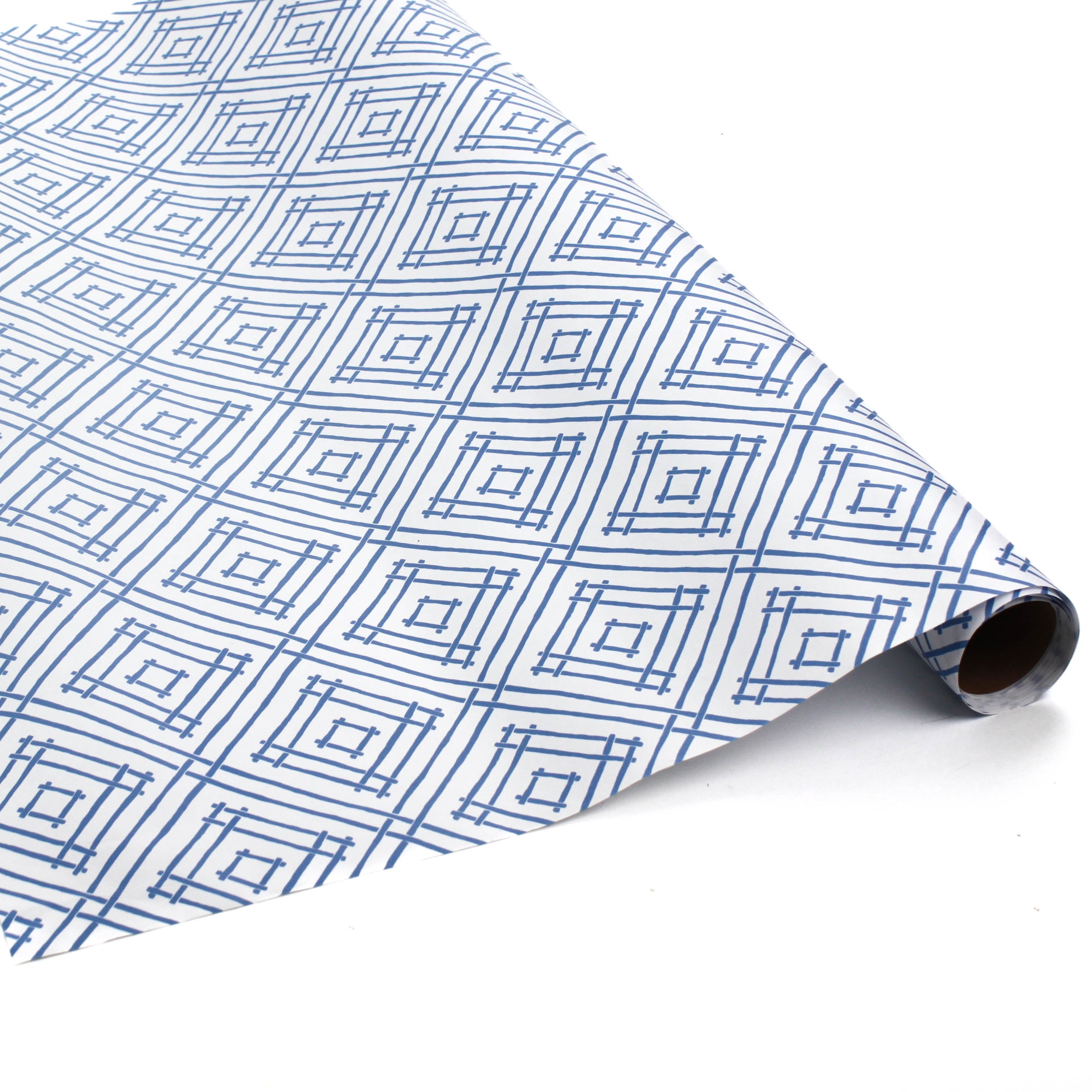 Roll of blue and white wrapping paper with a bamboo trellis design on a white background