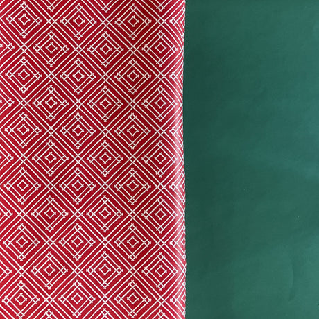 Rolls of wrapping paper with a geometric lattice pattern in red