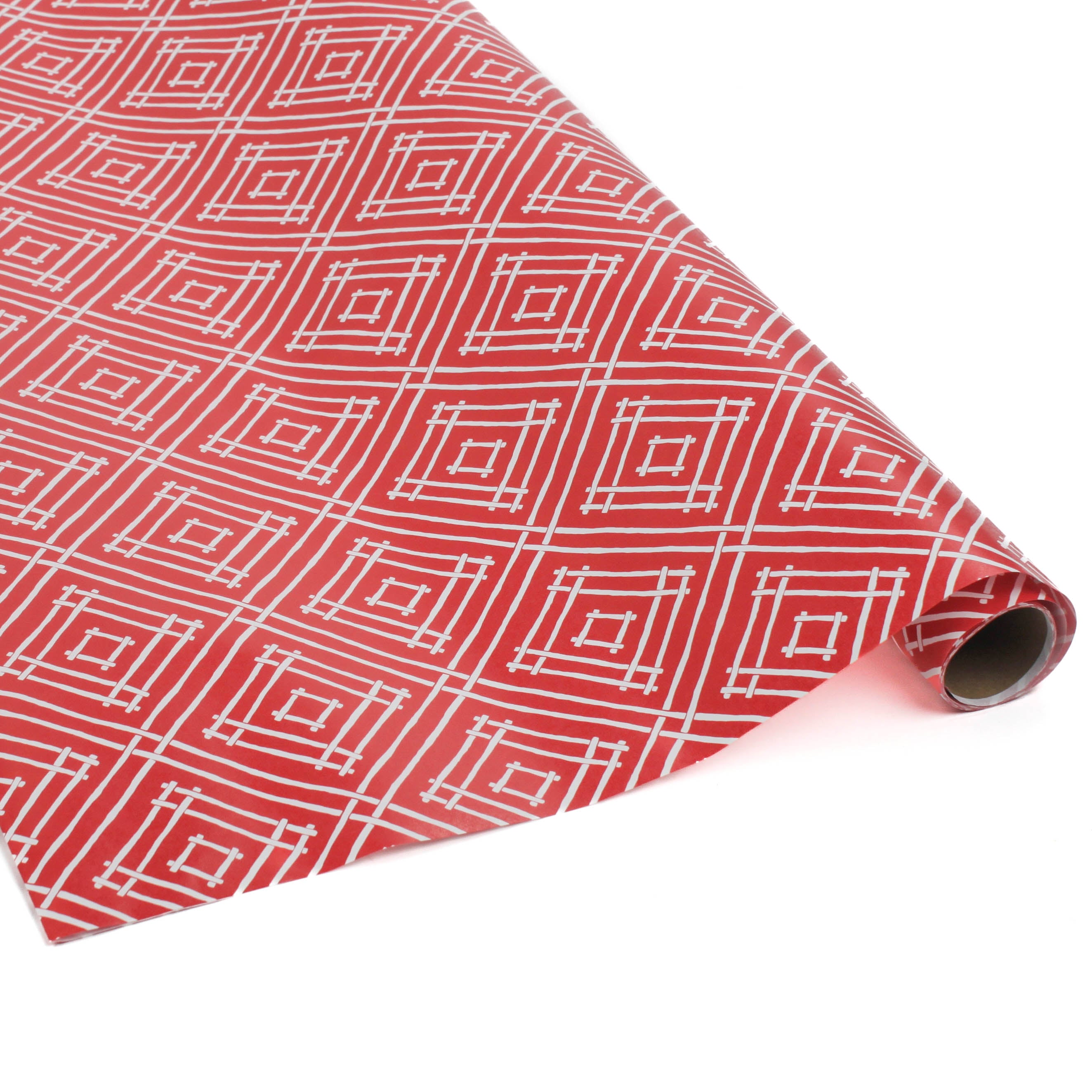 a roll of wrapping paper with a geometric lattice pattern in red