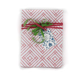 a wrapping paper with a geometric lattice pattern in pink