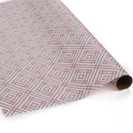 a roll of wrapping paper with a geometric lattice pattern in pink