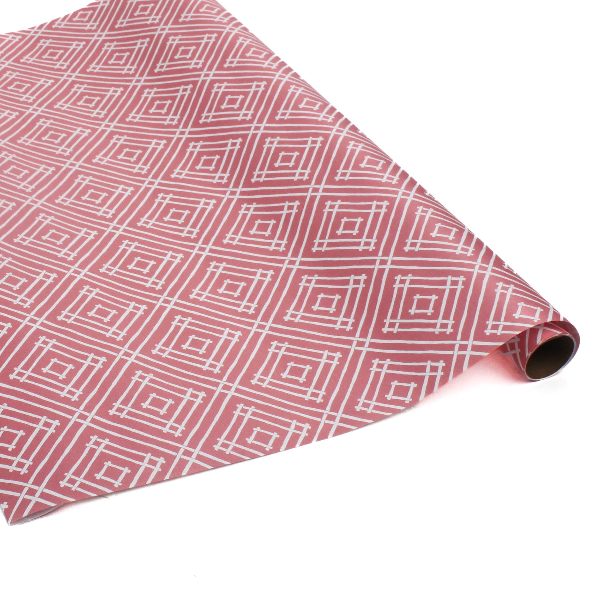 a roll of wrapping paper with a geometric lattice pattern in pink